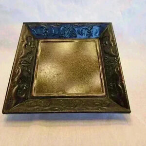 Decorative metal tray 10 1/4" x 10 1/4" and 2" tall. Black in color